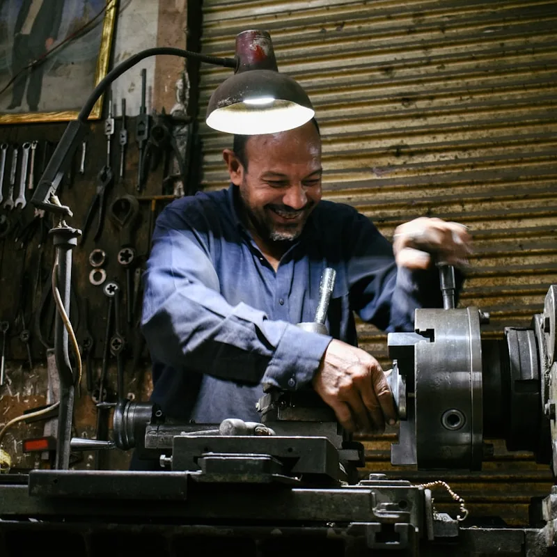 Axtratech machinist precision turning a component in the workshop