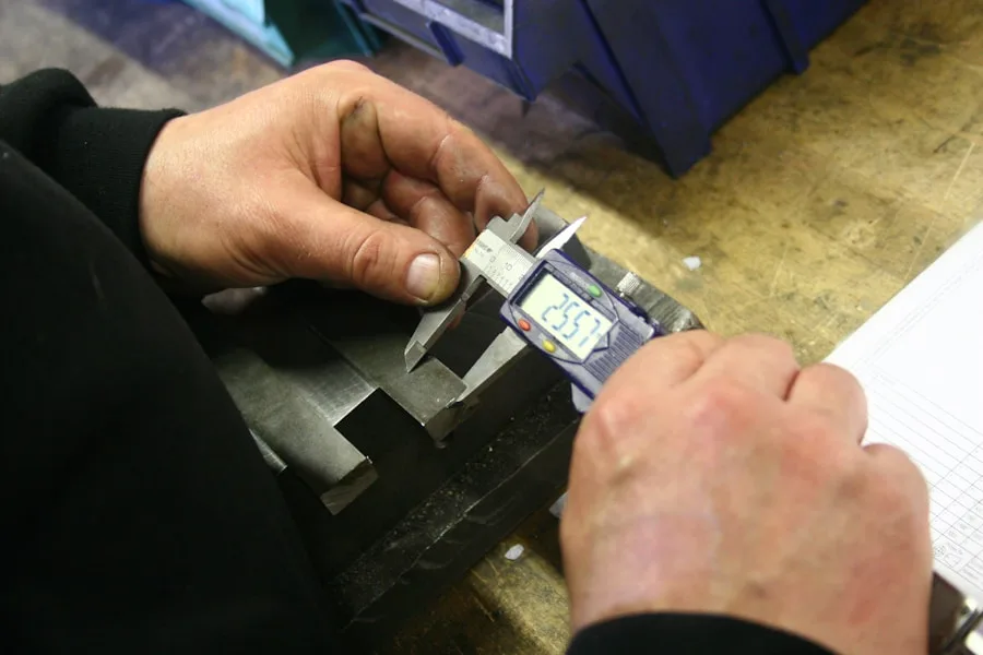 Quality inspection of a machined part with a digital caliper